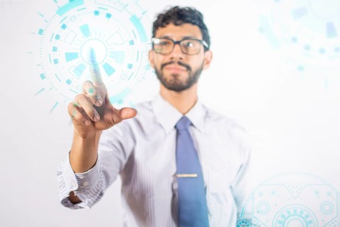 Businessman touching holographic icons