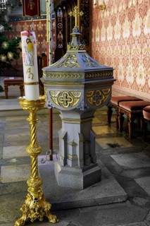 Baptismal font with candle