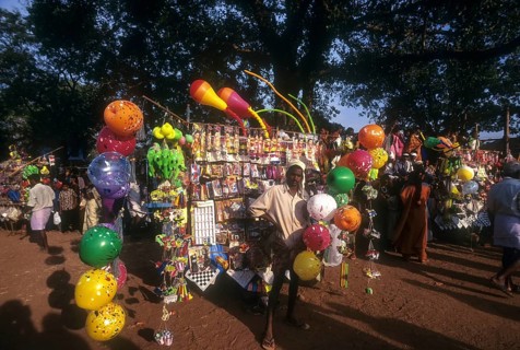A traditional balloon vendor selling balloons during Anthimahakalan Kavu festival