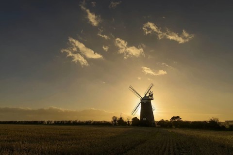 View of tower mill silhouetted in late evening