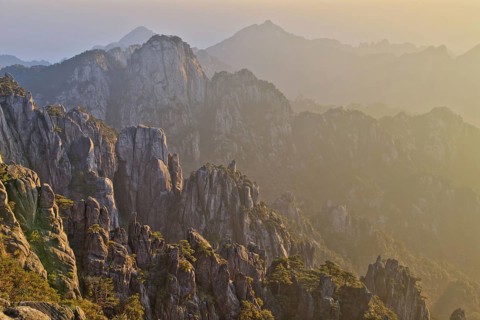 View of mountain range with granite peaks at sunrise