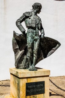 Monument to the torero Cayetano Ordonez in front of the bullfighting parade