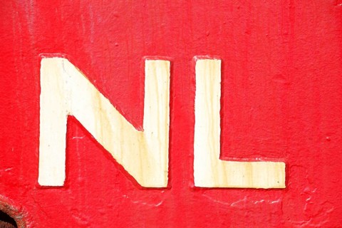 Country sign Netherlands on a red ship's side