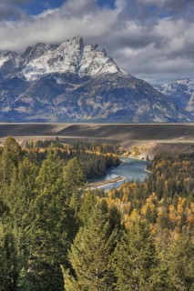 View of mountain range and forested river valley