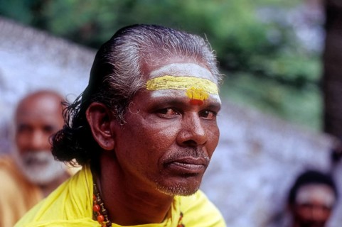 A Sadhu sitting on the steps of Arulmigu Dhandayuthapani Swamy Temple at Palani near Coimbatore