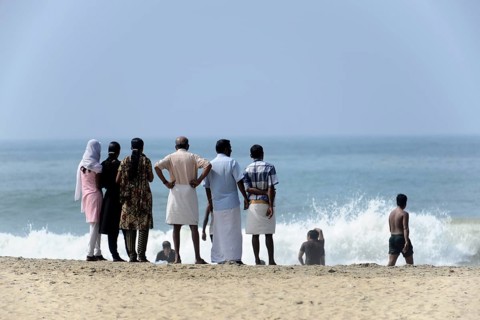 Holidaymakers on the beach of Kovalam