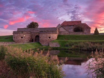Heldrungen moated castle and fortress at sunset