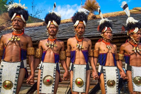Naga tribesmen in traditional dress perform ritual dances