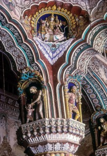 Siva and Parvathi seated on Rishaba or bull. 18th century stucco works and fresco painted pillars of Maratha Darbar hall inside Thanjavur palace complex