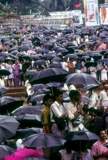 Crowd with umbrellas in raining during Pooram festival in Thrissur or Trichur