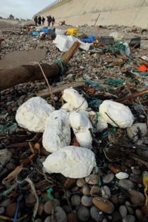 Rancid vegetable oil amongst rubbish washed up on beach