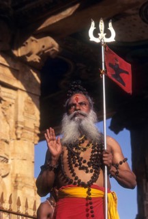 A sadhu standing on the floor of Nandi mandap in Brihadeeswarar Temple