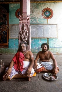 Priest sitting in the corridor of the Vaitheeswaran Temple