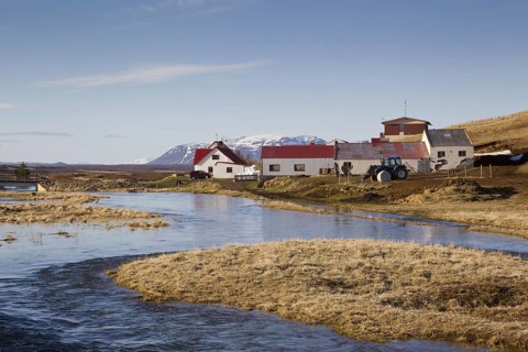 View of river and farm buildings