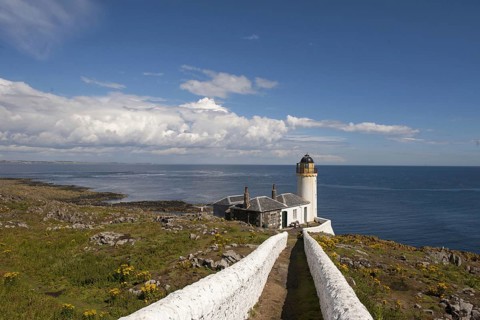 View of coastline and bird observatory housed in former lighthouse