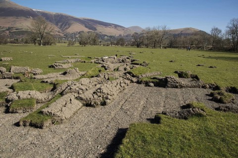 Earthen grassland peeled back by field flooding
