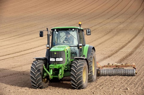 John Deere tractor pulling the soil press