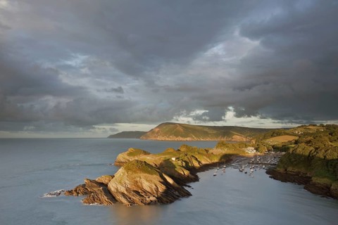 Rain clouds gathering in the evening over the rocky coastal peninsula and bay