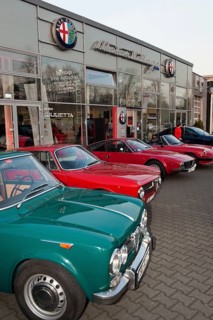 Alfa Romeo classic car in front of Alfa Romeo branch