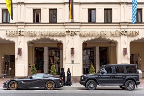 Parked sports car Ferrari F12 Berlinetta and SUV Mercedes-Benz AMG G 63
