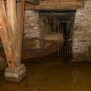 View of antker drainage canal in substructure Arenakeller cellar of historic Roman amphitheatre of Trier Treverorum Augusta with supports stamp of wood in groundwater