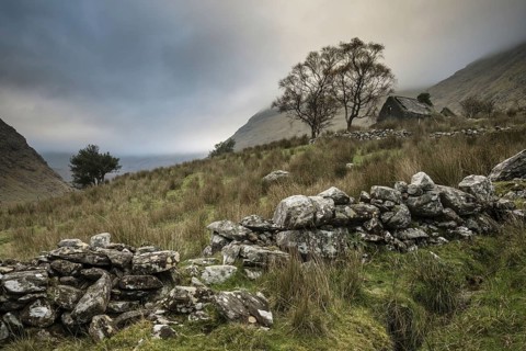 View of drystone walls and abandoned farmhouse