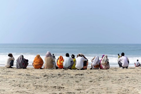 Holidaymakers on the beach of Kovalam