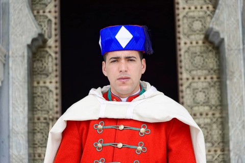 Guard in traditional uniform in front of the gate Mausoleum Mohammed V and Hassan II
