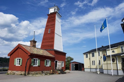 Wooden lighthouse in fishing village