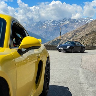 Porsche sports car on the left GT4 in the background 911 on Jaufenpass