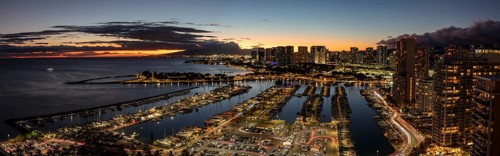 Dusk at the Ala Wai boat harbour with a view over Waikiki to Honolulu