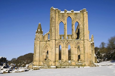 View of the ruins of a Cistercian abbey in the snow