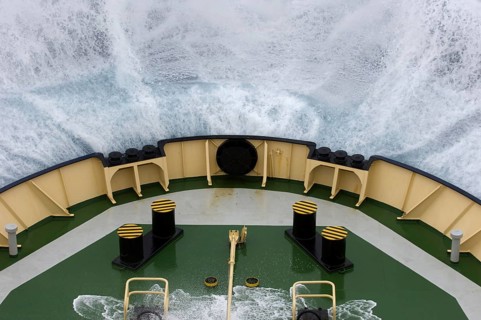 Bow of the icebreaker Kapitan Chlebnikow crashes into a wave in rough seas