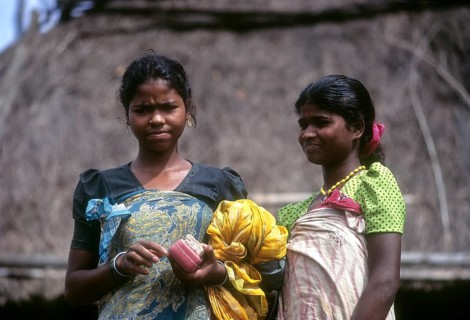 Betta Kurumba tribal Ladies standing in front of the hut