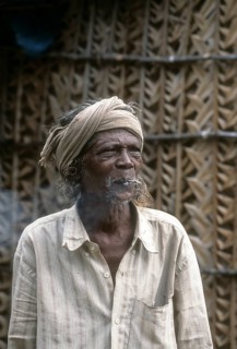 A Kurumba Tribal man smoking beedi
