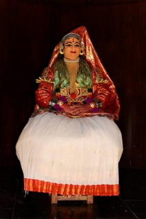 Fully made up and costumed Kathakali dancer performing