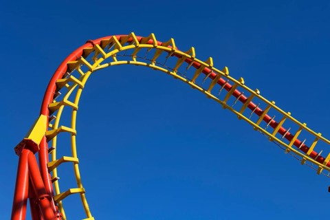 Roller coaster in front of blue sky