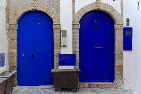 House front with blue entrance door