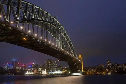 View of bridge and city skyline at night