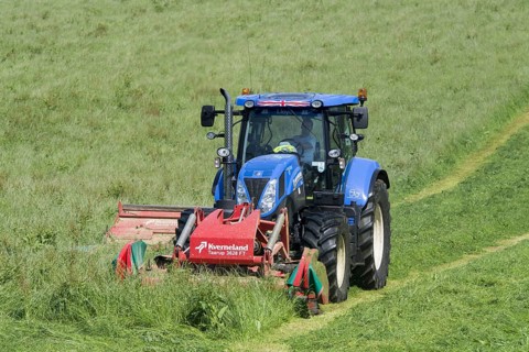 New Holland T7 tractor with Kvernland front and side mower conditioner