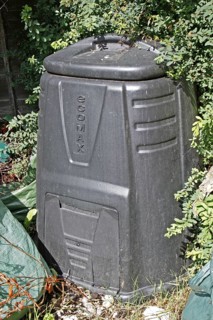 Plastic compost bin in garden