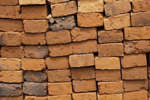 Sun-dried bricks stacked and ready for use
