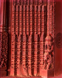 Richly carved wooden door of an old house portal in kanadukathan