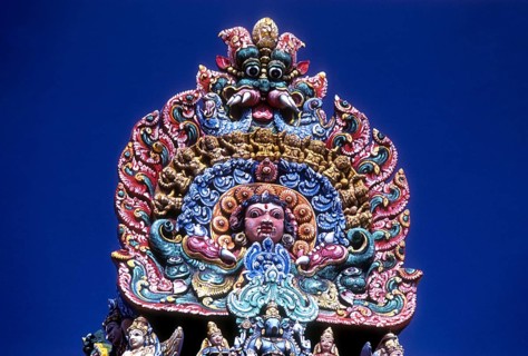 A temple carries this colourful sculpture of the fearsome kali