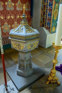 Baptismal font with candle