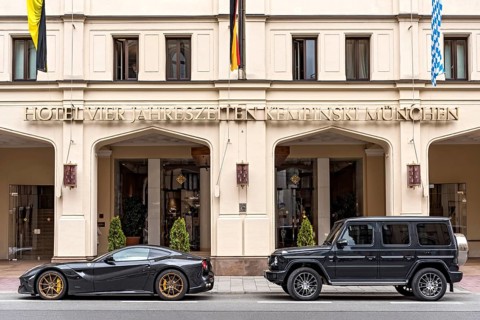 Parked sports car Ferrari F12 Berlinetta and SUV Mercedes-Benz AMG G 63