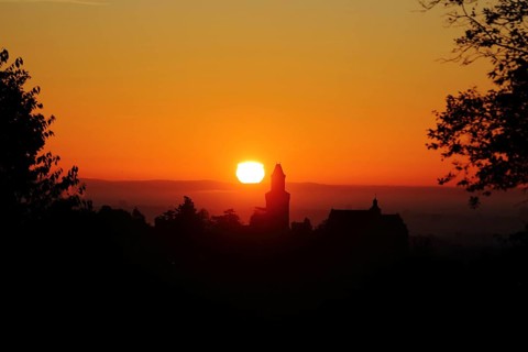 View of the silhouette of Kronberg Castle at sunrise in Kronberg