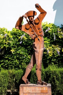 Monument of a torero in front of the bullfighting parade