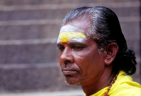 A Sadhu sitting on the steps of Arulmigu Dhandayuthapani Swamy Temple at Palani near Coimbatore
