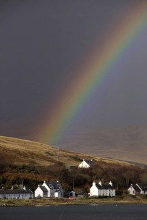 Rainbow over the houses on Craighouse Island Jura